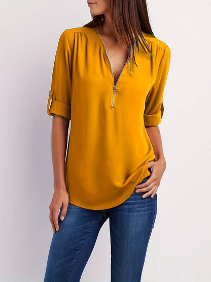 Hazel – casual, ruffled blouse with roll-up sleeves and half zip