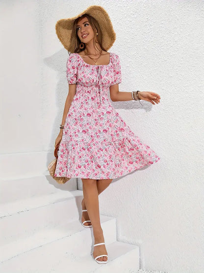 Emma - ruched dress with knot front and floral print