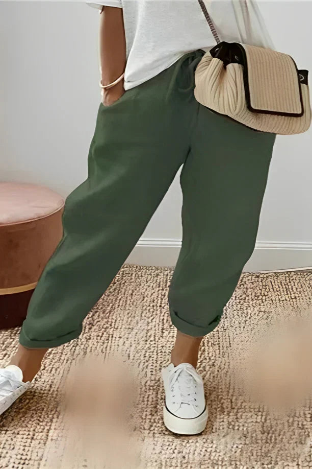 Plain-colored trousers with drawstring and slanted pocket