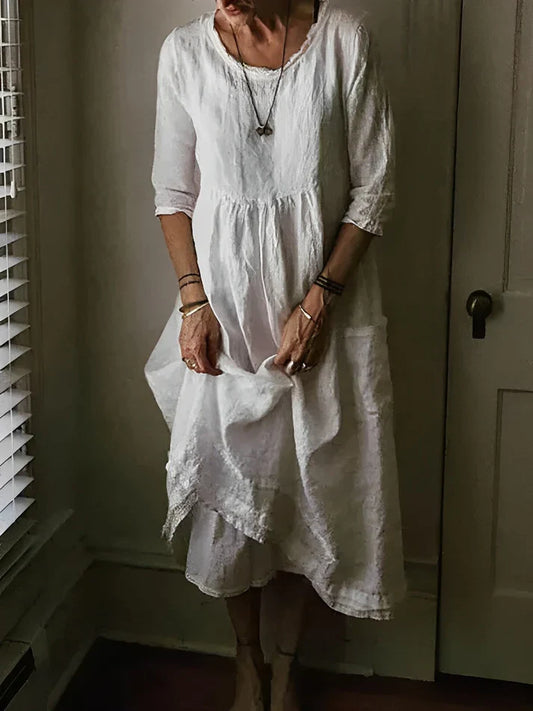 Dress with a round neckline and 3/4 sleeves made of linen blend