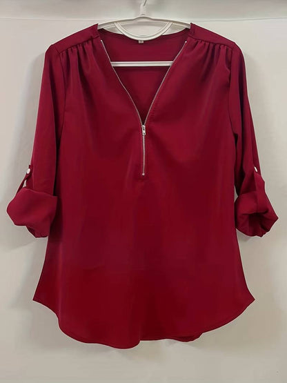 Hazel – casual, ruffled blouse with roll-up sleeves and half zip