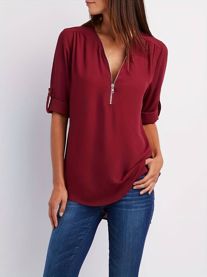 Hazel – casual, ruffled blouse with roll-up sleeves and half zip