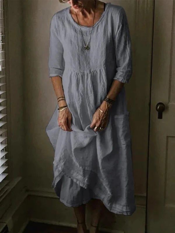 Dress with a round neckline and 3/4 sleeves made of linen blend